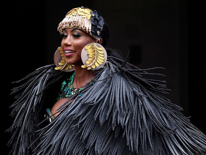 A Caribbean soca dancer displays her costume as she promotes the first ever digital Notting Hill Carnival, following the cancellation of the normal Carnival festivities due to the continued spread of the coronavirus disease (COVID-19), London, Britain, August 28, 2020. REUTERS/Toby Melville TPX IMAGES OF THE DAY